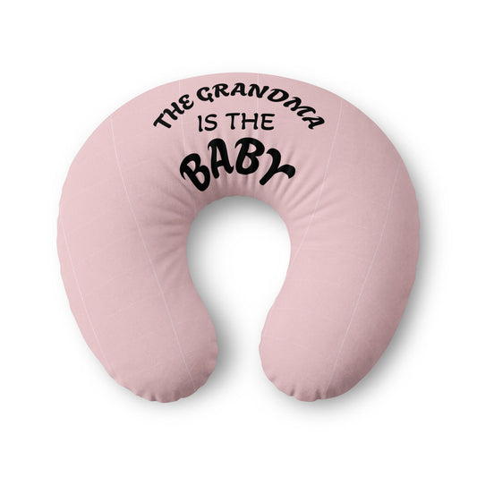 Pink Nursing Pillow Cover with text 'The Grandma is the Baby' on a white background